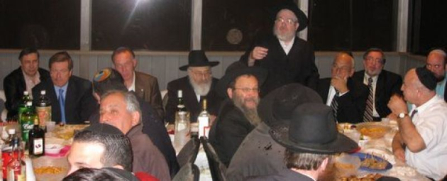 Enjoying a toast from Rabbi janowski