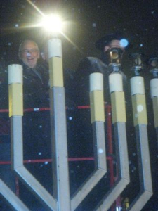 Peter lighting the menorah at the Jewish Russian Community Centre