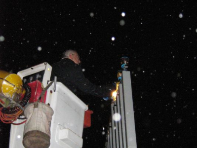 Peter lighting the menorah at Queen's Park