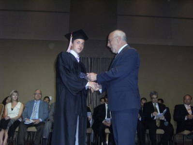 Peter presenting the Dorothy Day Award to Michael Colacci, St. Elizabeth CSS 2009 Graduation