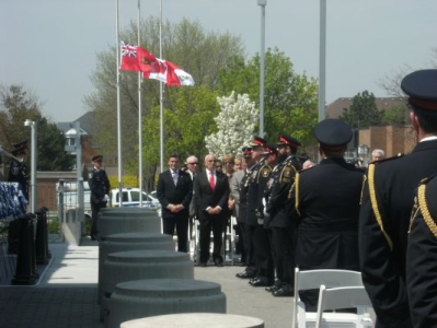 Peter standing in observance while the Last Post is played.