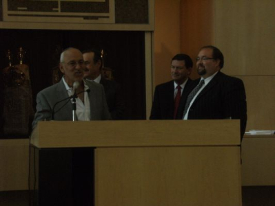 Peter presenting a Congratulatory Scroll to Rabbi Yossi Sapirman